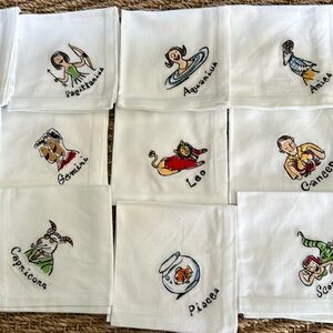 Pottery Barn set of 12, 100% cotton “what’s your sign” cocktail napkins.